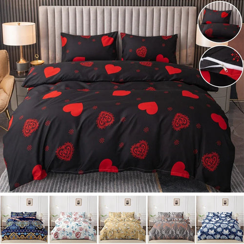 Black bedspread with red heart and rose patterns on a bed in a bedroom setting.
