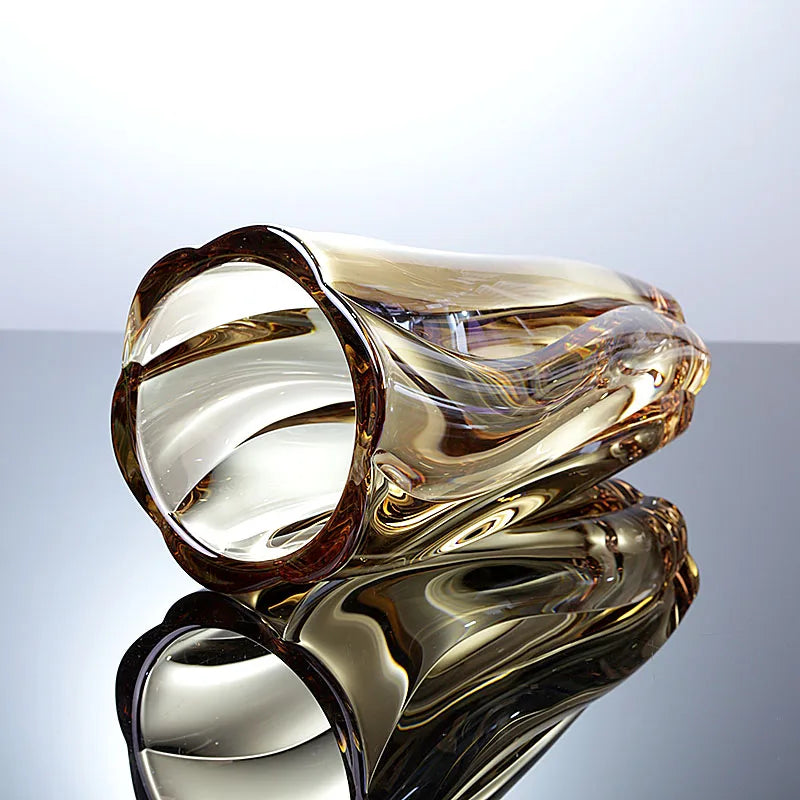 Sunset amber crystal glass vase featuring a rich golden gradient and spiralled texture.