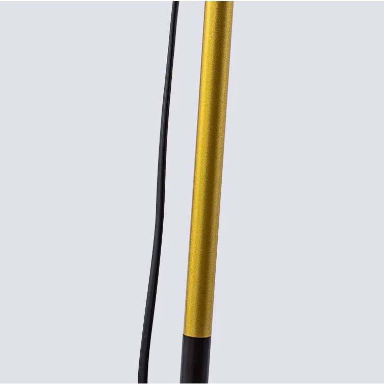 Close-up of gold accent detailing on the floor lamp pole