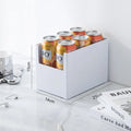 White can holder with Rio cans on a marble surface, with dimensions displayed.