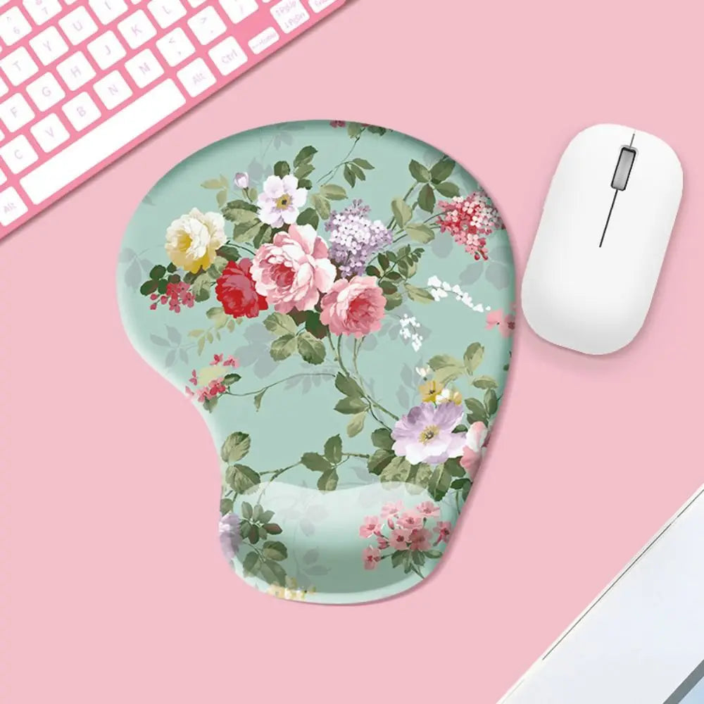 Floral mouse pad with a white mouse on a pink surface