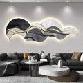 Large sculptural LED wall light with warm backlit glow and wave-inspired abstract design