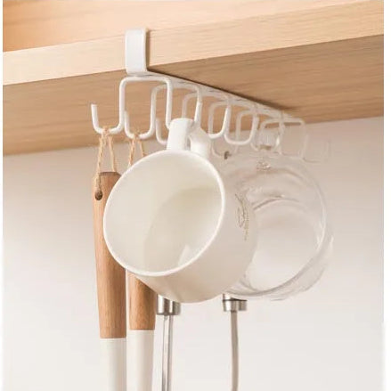 White hanging rack with kitchen utensils and measurements on a white background