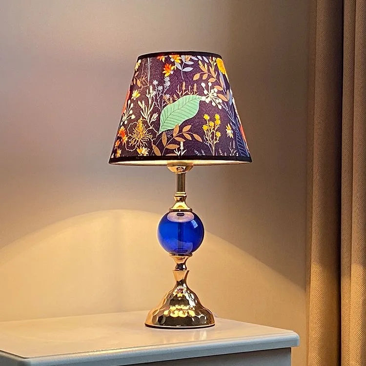 Modern bedside lamp styled on a nightstand with warm lighting