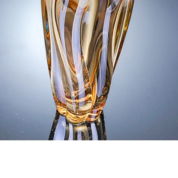 Sunset amber crystal glass vase featuring a rich golden gradient and spiralled texture.