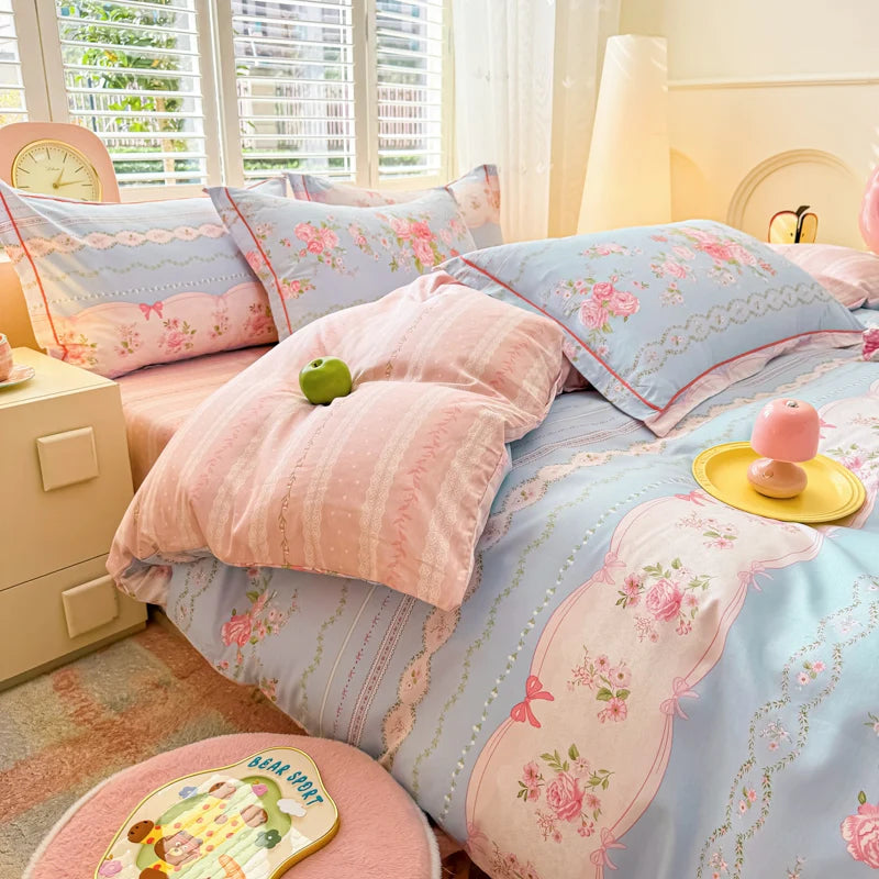 Blue Gingham cotton duvet cover with decorative pink bows and floral vine details.