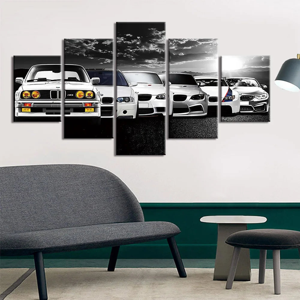 5-piece car wall art print styled above a grey sofa with green wall panelling and a floor lamp.