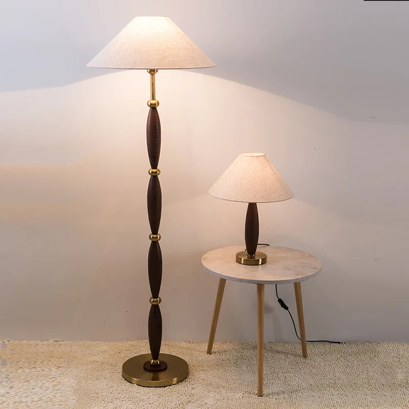 Matching floor lamp and table lamp styled together in a warm interior