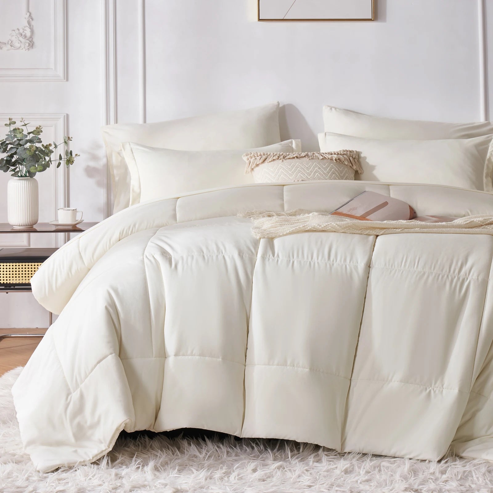 Neatly made bed with white bedding in a bright bedroom.