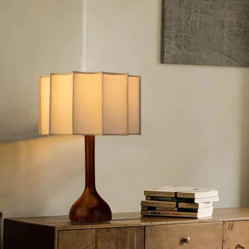Minimalist wooden desk lamp with linen shade on sideboard