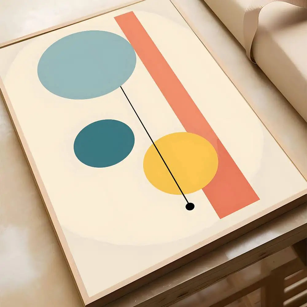 Minimalist abstract canvas print featuring light blue, teal, and yellow circles connected by a fine black line, with a bold terracotta vertical stripe on a cream background, in a wood frame.