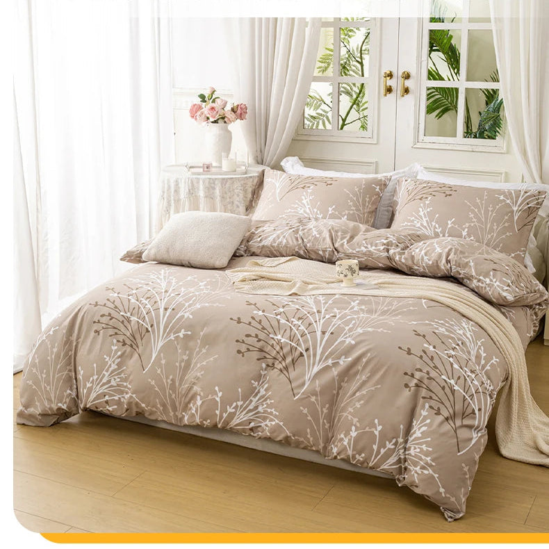 Sand beige duvet cover set with a delicate branch pattern and two matching pillowcases