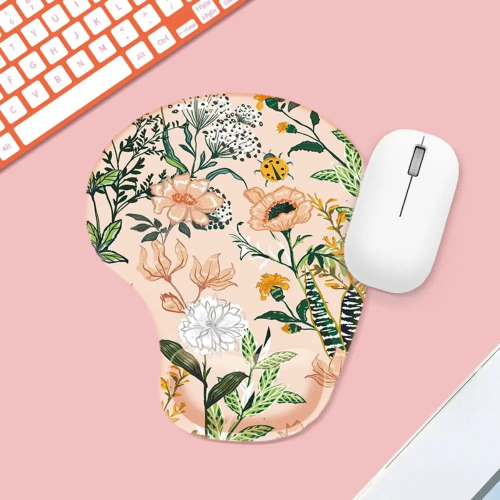 Floral mouse pad with a white mouse on a pink surface