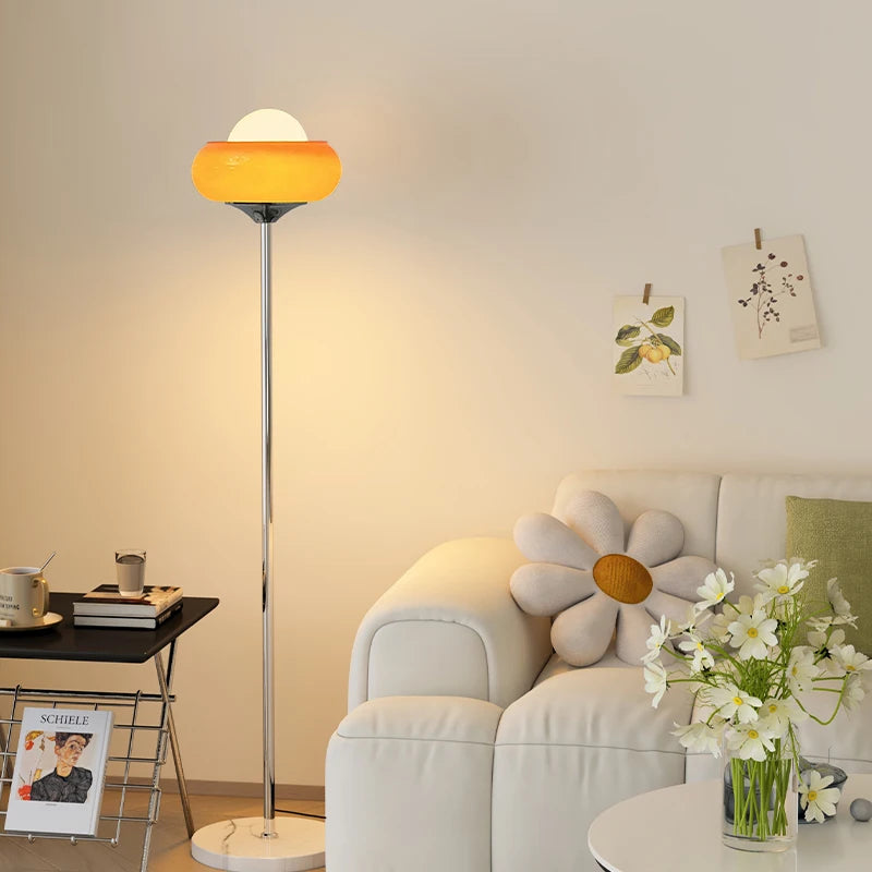 Living room with a floor lamp, sofa, and decorative elements