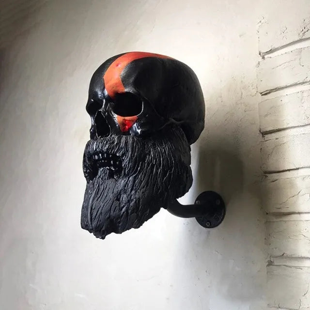 Black bearded skull decorative wall hanger with curved wall hook.