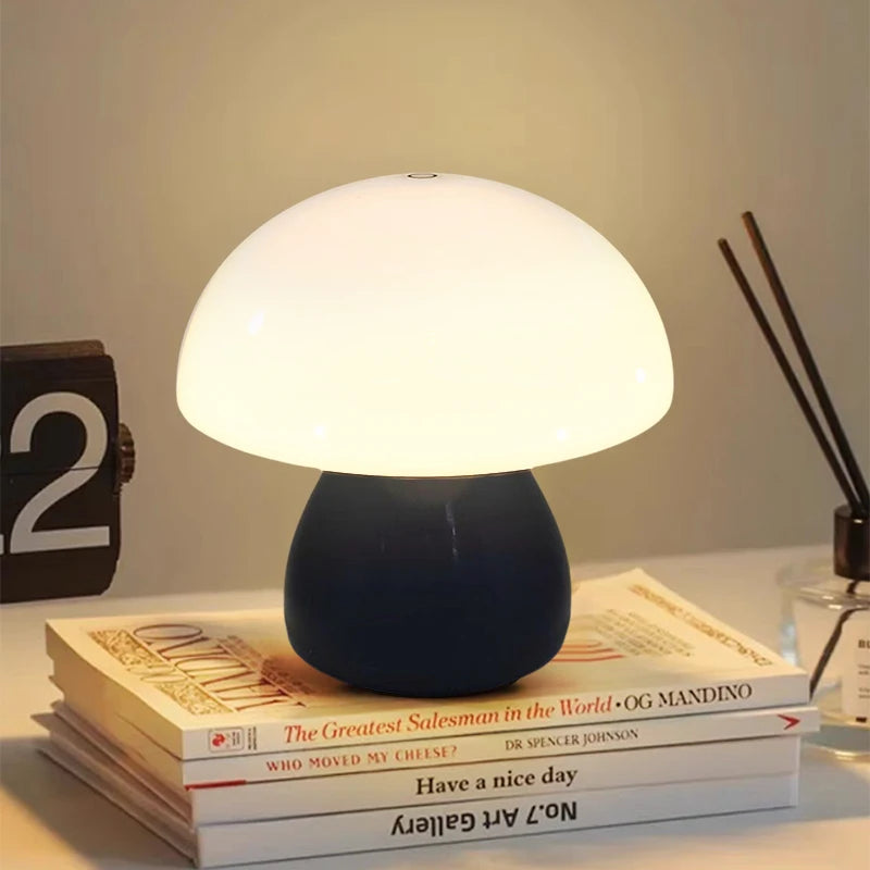 Mushroom-shaped table lamp on a stack of books with a warm glow