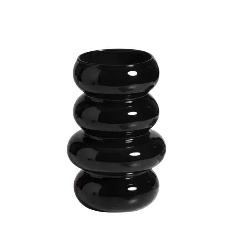 Black decorative vase with measurements on a light background