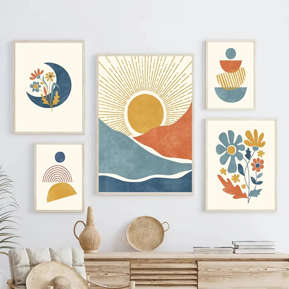 Set of abstract art prints on a wall above a wooden console table.