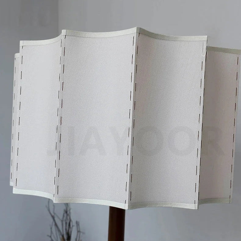 Linen lampshade with soft pleated texture on wooden lamp