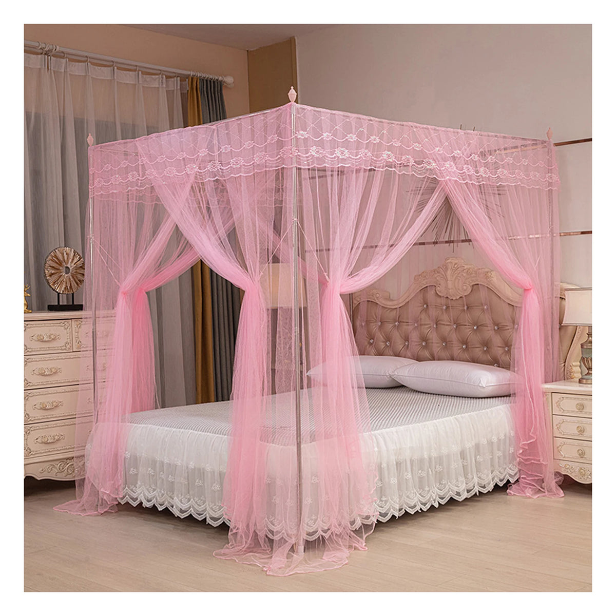 Pink four-poster lace canopy mosquito net draped over a bed