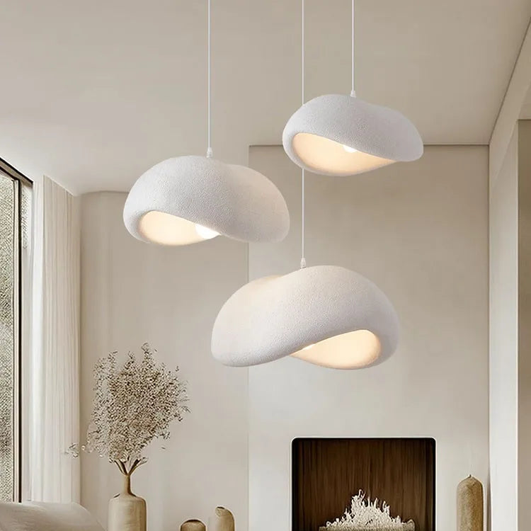 Three Wabi-Sabi pebble pendant lights hanging in a cluster with a size guide