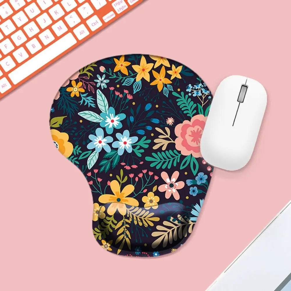 Floral mouse pad with a white mouse on a pink surface