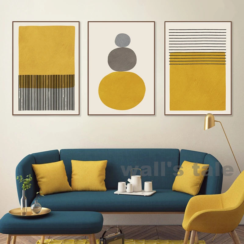Modern living room with a blue sofa, yellow chairs, and abstract art on the wall.
