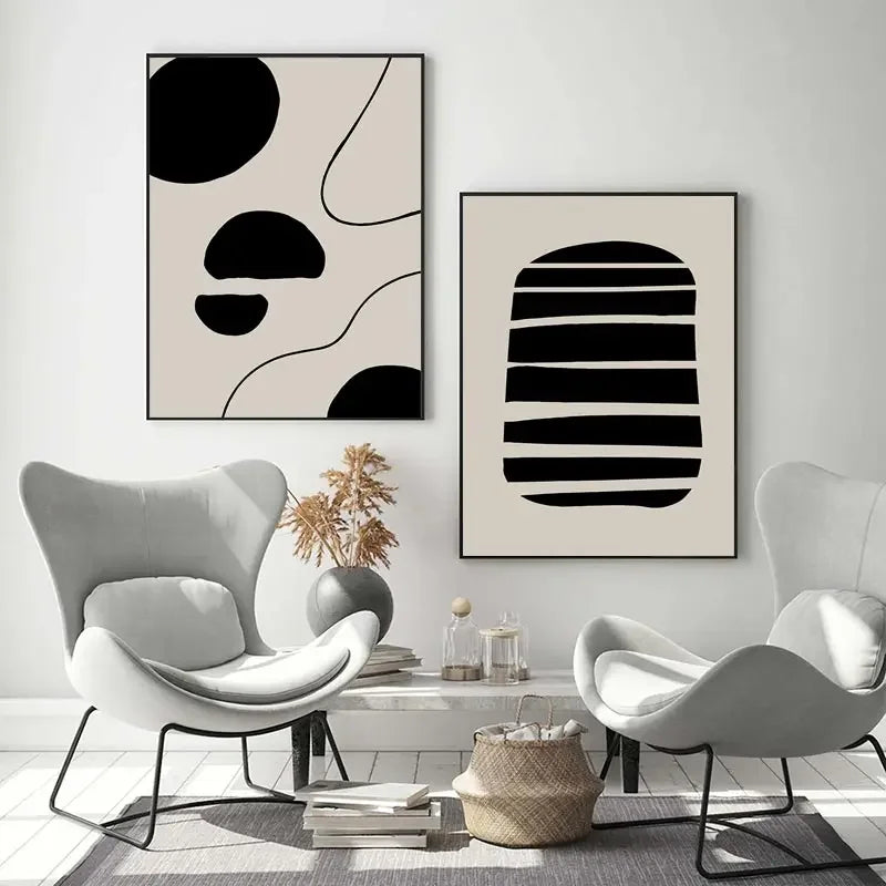 Modern living room with abstract art on the wall and two gray chairs.