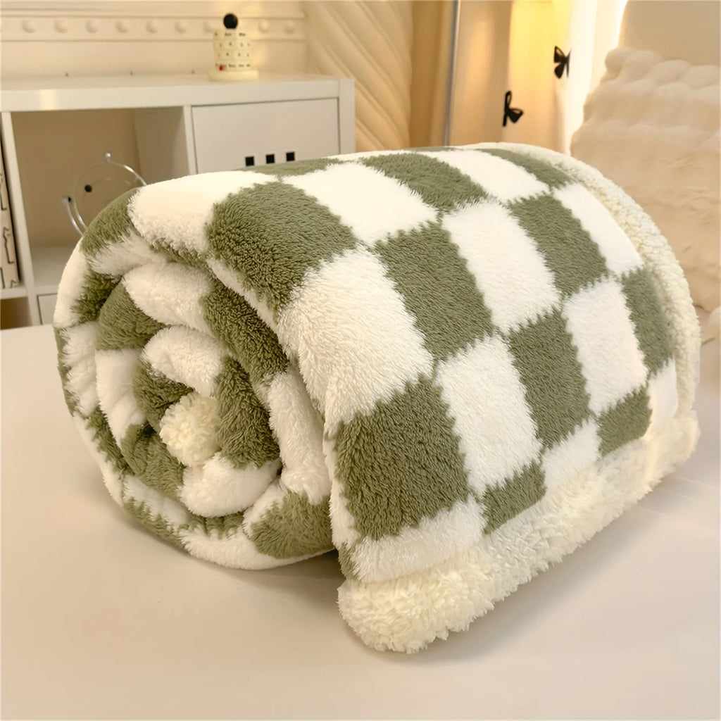 Green and white checkered blanket on a light surface
