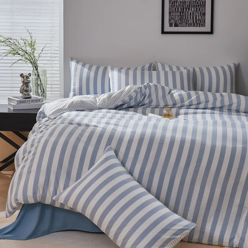 Powder blue and white striped twill bedding set with matching striped pillowcases