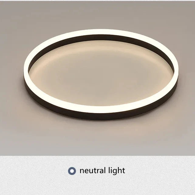 Modern ceiling light fixture with neutral light on a gray background