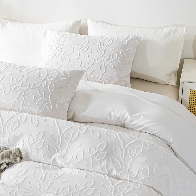 Close-up of brushed fabric and tufted botanical pattern