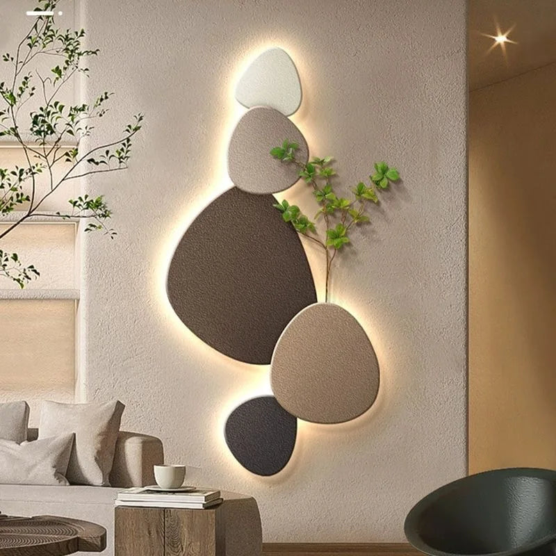Neutral stone decorative LED wall light with organic shapes, plant detail, and warm ambient glow