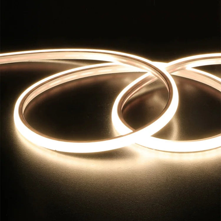 Warm light LED light strip with text on a black background