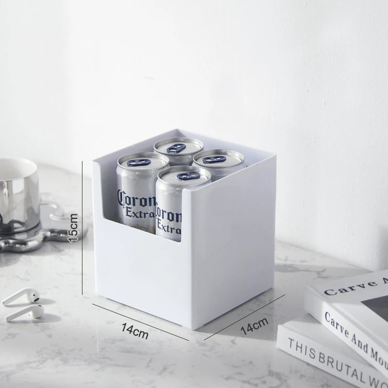 Box of Corona Extra beer cans on a marble surface with dimensions indicated.