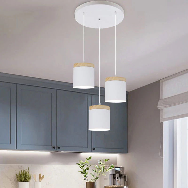 Modern kitchen with pendant lights hanging above a countertop.