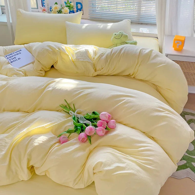 Butter yellow 100% cotton 4-piece bedding set styled in a sunlit bedroom