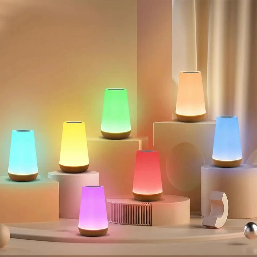 Colourful cylindrical lamps on a decorative setup with a soft background