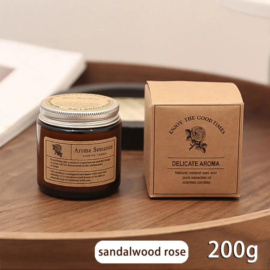 Sandalwood rose candle with packaging on a wooden surface