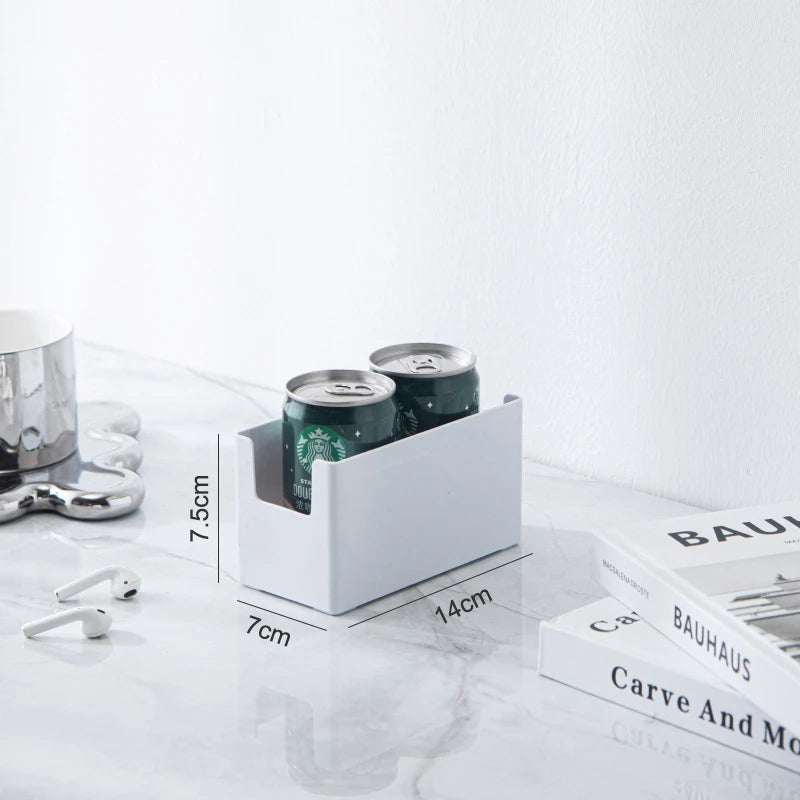 White can holder with two cans on a white surface with measurement details.