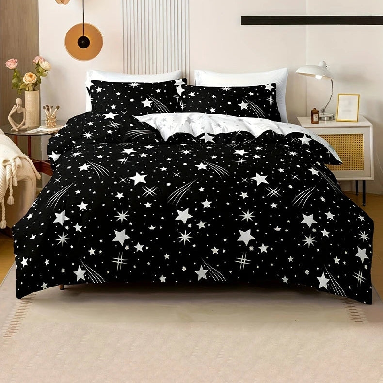 Black bedspread with white star pattern in a bedroom setting