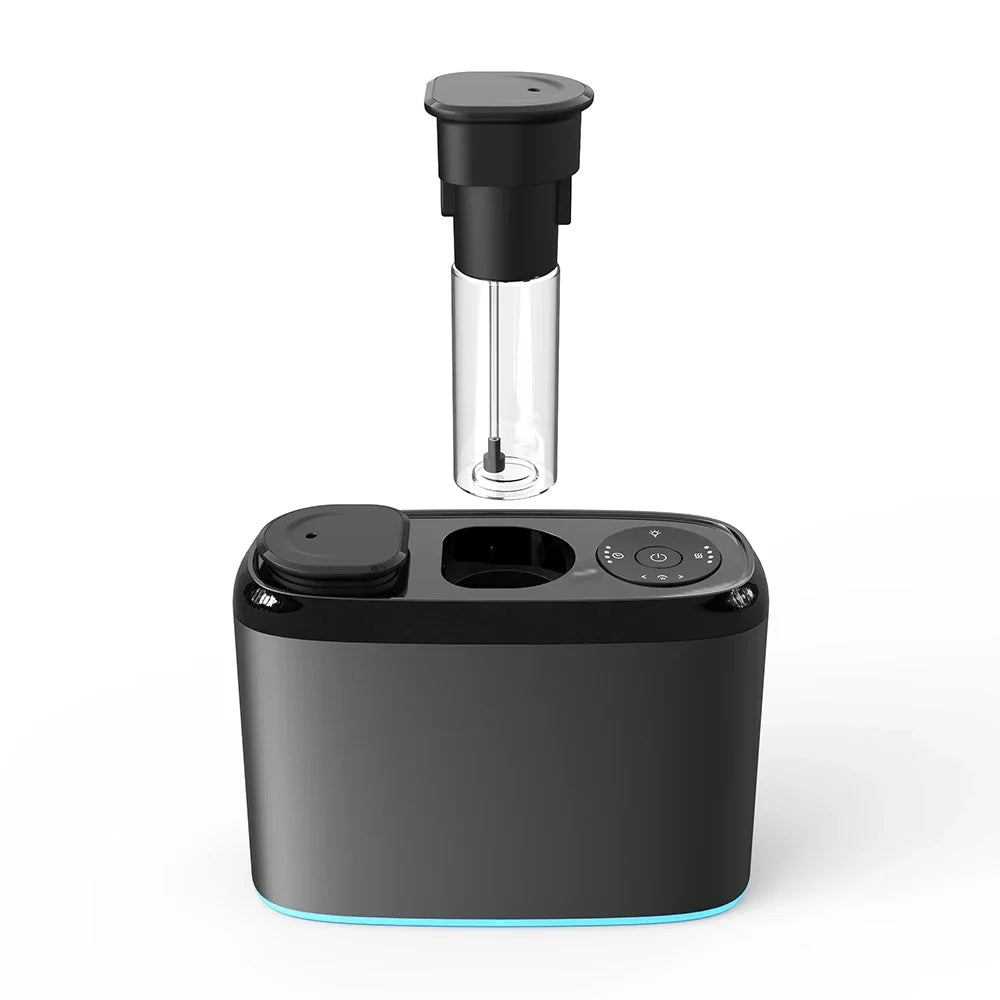 Black dual nozzle aroma diffuser with removable clear oil atomiser tube lifted from base, showing touch control panel