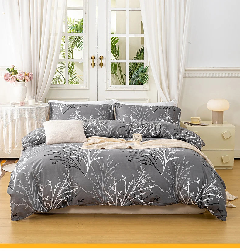 Grey 3-piece polyester bedding set with white botanical branch print and matching pillowcases