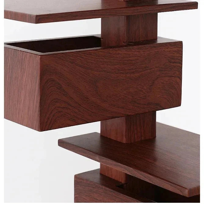 Detailed close-up of a rosewood grain geometric lamp showing stacked rectangular and flat elements
