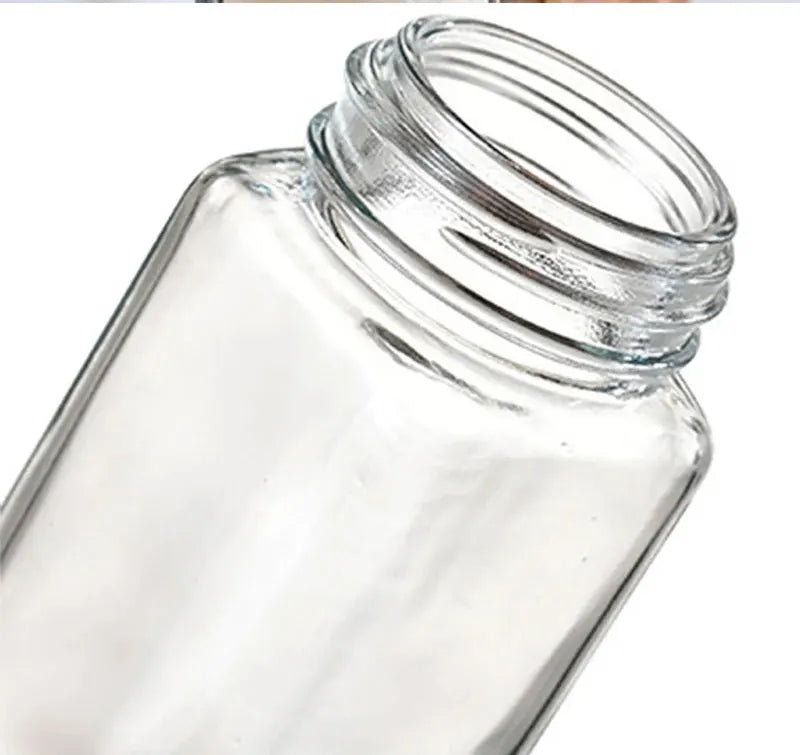Clear glass jar with a lid on a white background