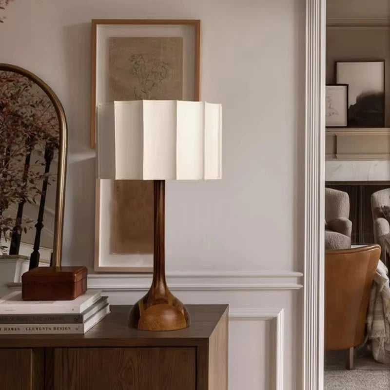 Minimalist wooden desk lamp with linen shade on sideboard