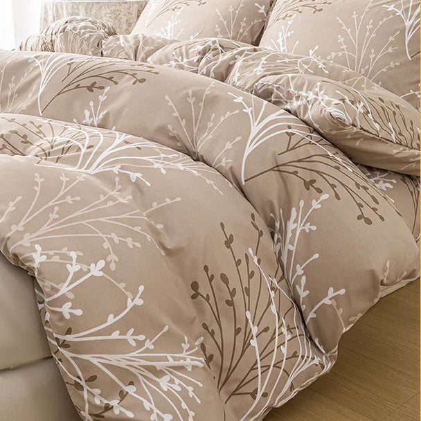 Sand beige duvet cover set with a delicate branch pattern and two matching pillowcases