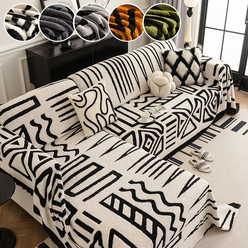 White tribal print sofa cover on L-shaped couch with cushions