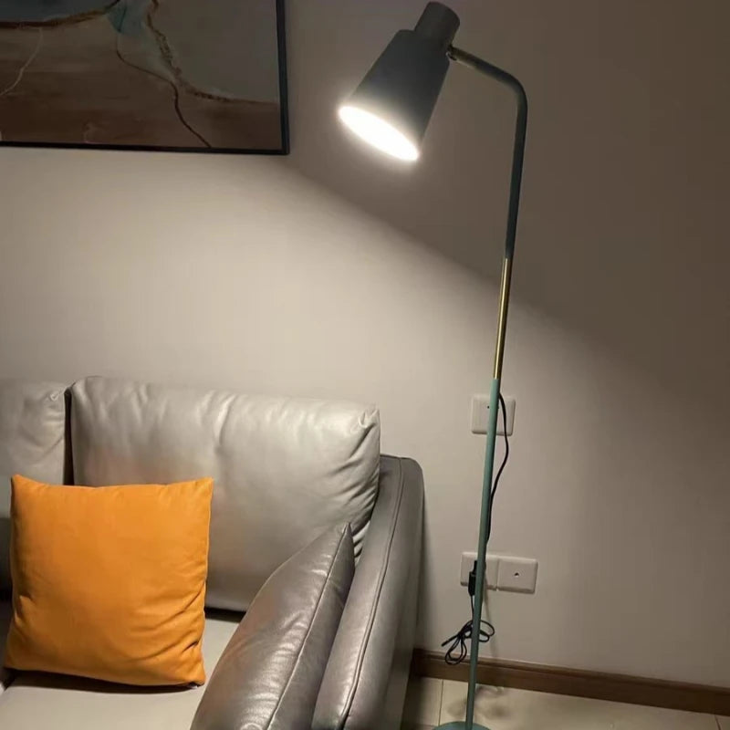 Green Nordic floor lamp with brass accent and round base