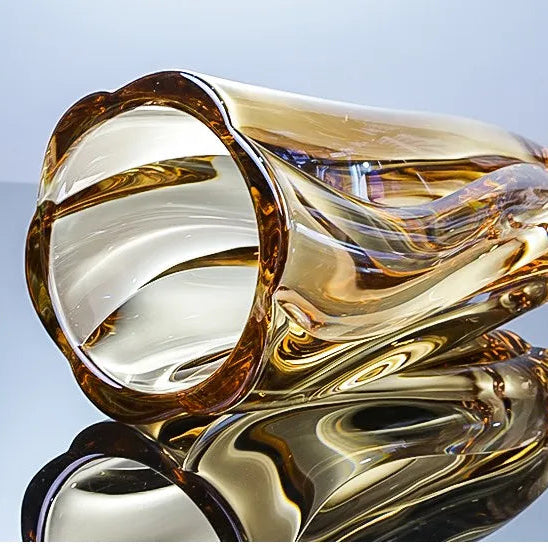 Sunset amber crystal glass vase featuring a rich golden gradient and spiralled texture.